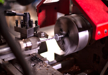 Drill holes with a drill on a lathe.