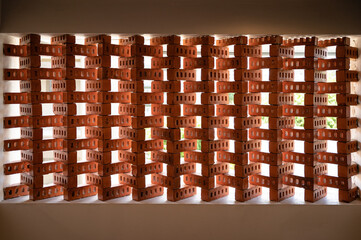 Orange brick block stacked in wall with sunlight shine