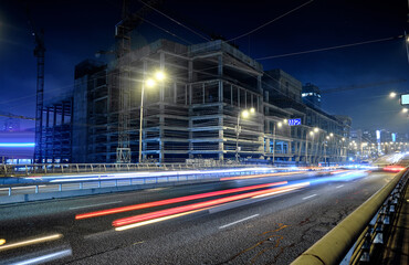 Fototapeta na wymiar Construction of a new building in Kyiv at night.