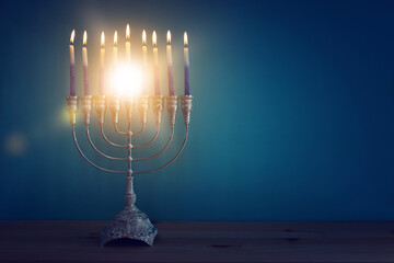 Religion image of jewish holiday Hanukkah background with menorah (traditional candelabra) and candles