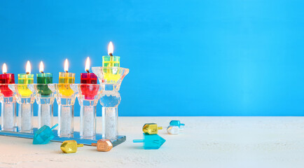 Religion image of jewish holiday Hanukkah background with menorah (traditional candelabra) and candles