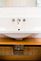 Ceramic Water tap sink with faucet with soap and towel in expensive loft bathroom or kitchen