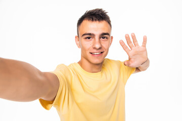 Fototapeta premium Happy man making selfie and greeting isolated on white background