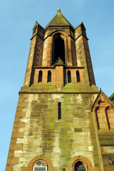 High Stone Tower of Old Church Seen from Below