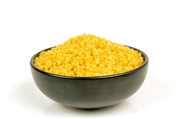 Sugar from sugarcane in black bowl isolated on white background.