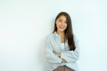 Asian woman wearing striped white shirt Smiling pretty, standing with arms crossed On a white background.