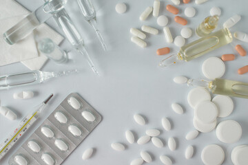 Medicines on a white background. Coronavirus treatment and protection. Vaccine, antibiotics,...