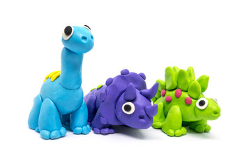 Play dough group Brachiosaurus, Triceratopson, Stegosaurus, on white background. Handmade clay plasticine