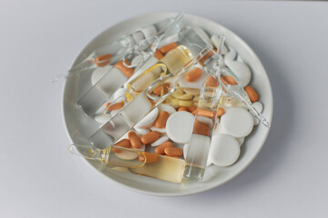 Medicines on a white background. Coronavirus treatment and protection. Vaccine, antibiotics,...