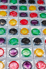 Colorful condoms background.