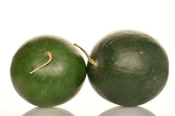 Ripe organic watermelons, close-up, on a white background.