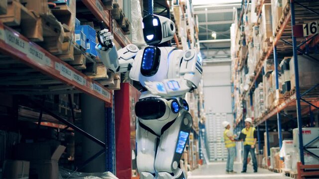 Closeup of warehouse robot conducting goods inventory