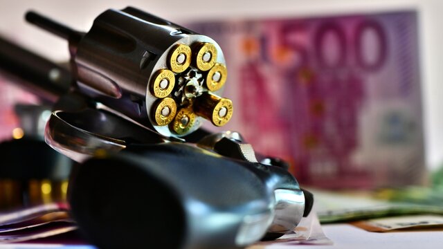Revolver Smith e Wesson 357 magnum on a background of euro banknotes. concept of robbery, dirty money, crime