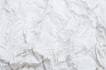Crumpled white paper background.