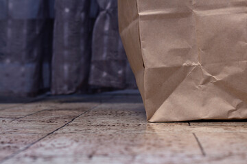 Paper decaying shopping bag on the floor