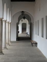 clean white corridor with bench bathed in white light