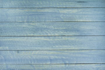 Fototapeta premium Vintage blue wood background texture with knots and nail holes. Old painted wood wall. Blue abstract background. Vintage wooden dark blue horizontal boards. Front view with copy space