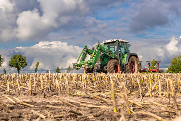Tractor with reversible plough during field work - 4223