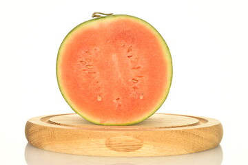 Ripe organic watermelons, close-up, on a white background.