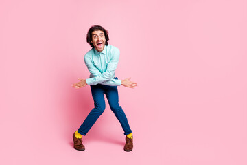 Fototapeta na wymiar Full size photo of young handsome man have fun enjoy music dance excited crazy isolated over pink color background