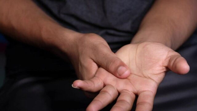 man suffering pain in hand close up 