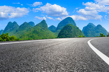 Empty asphalt highway and green mountain natural scenery in Guilin,China.
