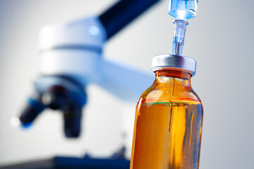 Medical vial with medication and syringe close up