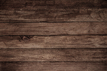 Vintage brown wood background texture with knots and nail holes. Old painted wood wall. Brown abstract background. Vintage wooden dark horizontal boards. Front view with copy space