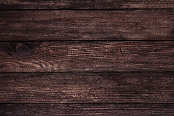 Vintage brown wood background texture with knots and nail holes. Old painted wood wall. Brown abstract background. Vintage wooden dark horizontal boards. Front view with copy space
