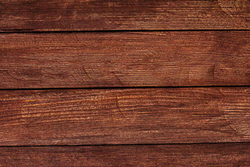 Fototapeta premium Vintage brown wood background texture with knots and nail holes. Old painted wood wall. Brown abstract background. Vintage wooden dark horizontal boards. Front view with copy space