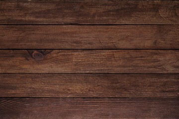 Obraz premium Vintage brown wood background texture with knots and nail holes. Old painted wood wall. Brown abstract background. Vintage wooden dark horizontal boards. Front view with copy space