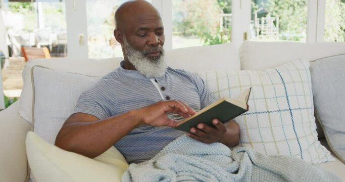 Senior african american man reading book