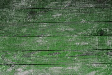 Vintage green wood background texture with knots and nail holes. Old painted wood wall. Brown...