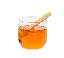 glass jar of honey and stick isolated on white background