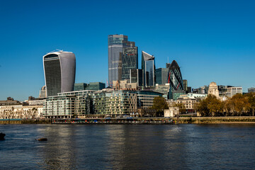 Fototapeta na wymiar River Thames and the City of London low angle over the water in bright sunlight