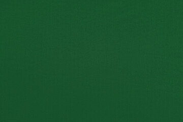 Green homogeneous background with a textured surface