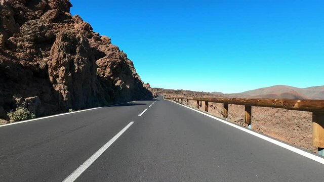 Long asphalt road ground view and travel concept - mountain and sky landscape - outdoor road trip in scenic place background