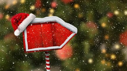 Digital animation of snow falling over santa hat on red wooden sign post against christmas lights - Powered by Adobe