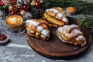 New Year's breakfast with croissants. set of three New Year's croissants. New Year's croissants with caramelized banana, orange and pineapple