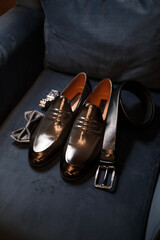 Morning details of a stylish groom with leather shoes