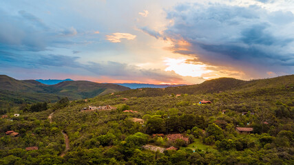 Mountains and in the background a beautiful sunset view from drone