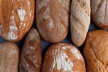Flat lay bread background. Freshly baked assortment of bread.
