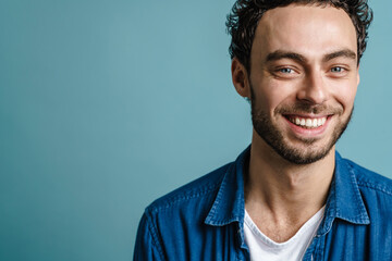 Happy handsome guy smiling and looking at camera