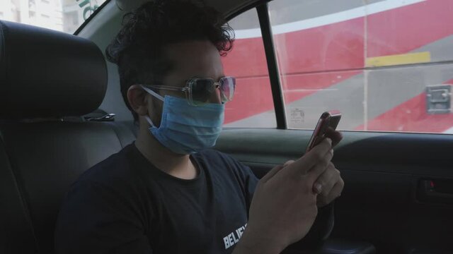Vivaan seating in-cab texting on the phone wearing mask new normal