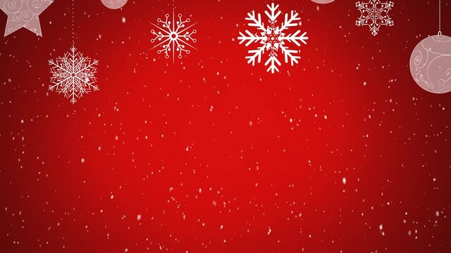 Digital animation of snow falling over christmas star and bauble decorations against red background