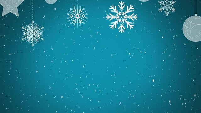 Digital animation of snow falling over christmas star and bauble decorations against blue background