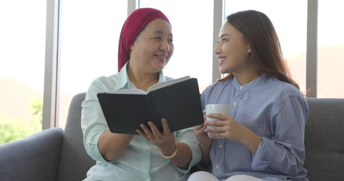 Young Asia woman take care of patients into the cancer. Her mother with cancer.