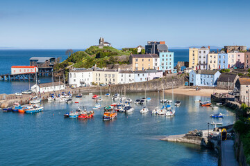 Tenby Harbour which is a popular seaside resort town in Pembrokeshire South Wales and a popular travel destination tourist attraction landmark, stock photo image - obrazy, fototapety, plakaty