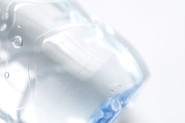 Close up photo of bottom of plactic bottle on white background