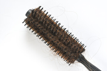 Dirty Round Hair Brush on white background close up photo